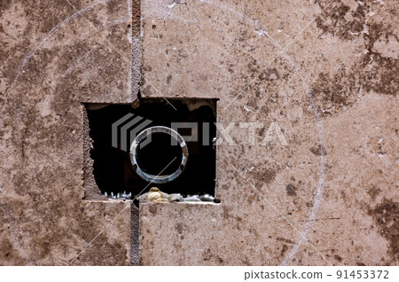 Cut-out section in bathroom shower tile with pipe connection protruding for water hookup. Cut-out section in bathroom shower tile with pipe connection protruding for water hookup. 91453372
