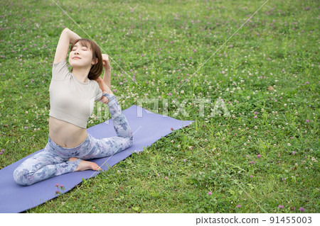 Park yoga half pigeon pose 91455003