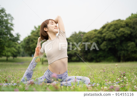 Park yoga half pigeon pose Park yoga half pigeon pose 91455116