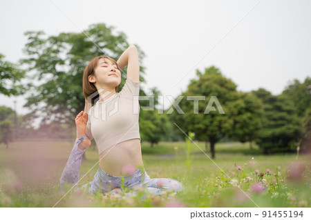 Park yoga half pigeon pose Park yoga half pigeon pose 91455194