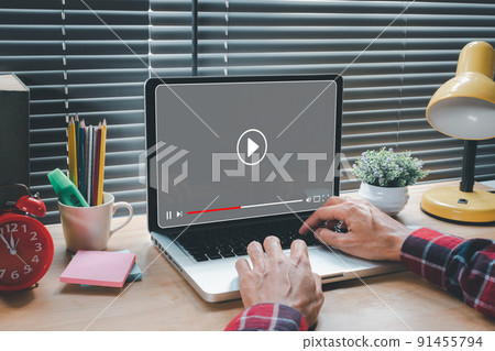 Video streaming on internet, Woman watching online movie or TV series on laptop computer, Concept about subscription based live digital stream. 91455794