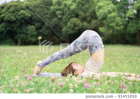 Park yoga plow pose Park yoga plow pose 91455850