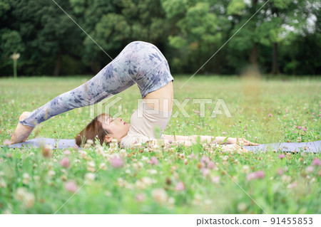 Park yoga plow pose Park yoga plow pose 91455853