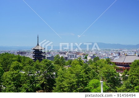 A distant view of Kofukuji Temple after the refreshing rainy season 91456494