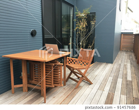 Work from home on a wooden deck Work from home on a wooden deck 91457686