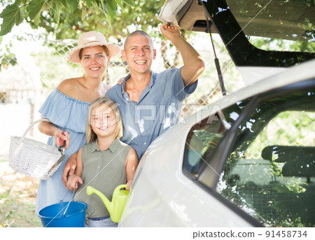Portrait of happy family near car in country Portrait of happy family near car in country 91458734