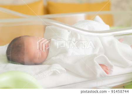 Newborn sleeping in a baby cot Newborn sleeping in a baby cot 91458744