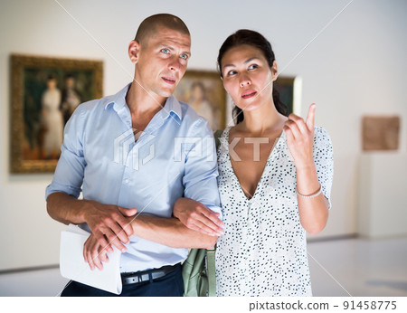 couple admiring art work couple admiring art work 91458775