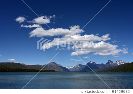 Summer cloudscape over Lake McDonald in Glacier National Park, Montana. 91459683