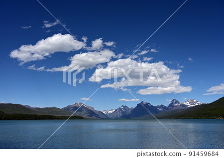 Summer cloudscape over Lake McDonald in Glacier National Park, Montana. 91459684