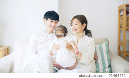 A couple holding a baby Child-rearing image 91462251
