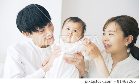 A couple holding a baby Child-rearing image 91462260