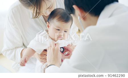 Doctor who examines a baby Pediatrician Infant examination 91462290