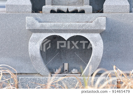 Tombstone of a grave A candle stand that looks like a heart Tombstone of a grave A candle stand that looks like a heart 91465479
