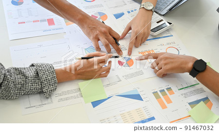 Close-up, A group of professional financial analysts voting the best financial plan for their business 91467032