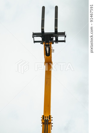 Forklift industrial loader or stacker against sky. 91467591