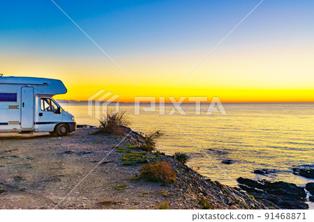 Rv camper camping on sea shore, Spain. Rv camper camping on sea shore, Spain. 91468871