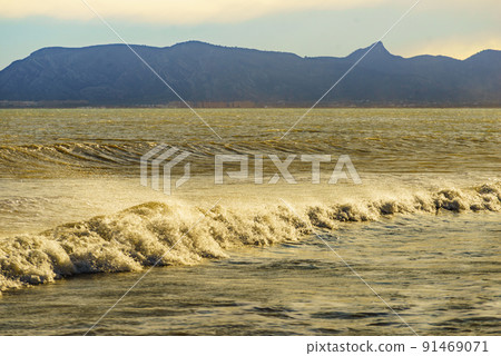 Sea waves forming white foam on sunny day. Sea waves forming white foam on sunny day. 91469071