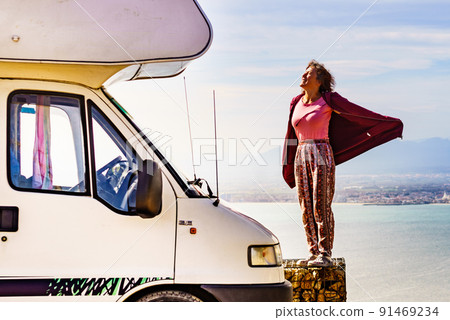 Woman enjoy caravan vacation. Woman enjoy caravan vacation. 91469234