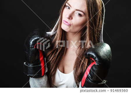 Sport boxer woman in black gloves boxing Sport boxer woman in black gloves boxing 91469360