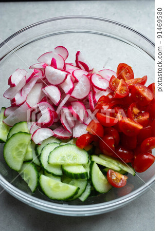 Fresh tomatoes, radish and cucumber salad. Concept of summer tasty and healthy appetizer. Close up. 91469580