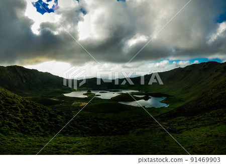 Landscape sunset view to Caldeirao crater, Corvo island, Azores, Portugal Landscape sunset view to Caldeirao crater, Corvo island, Azores, Portugal 91469903
