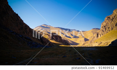 Sunset view to Tash-Rabat river and valley in Naryn province, Kyrgyzstan 91469912