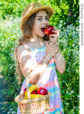 Strong teeth for good eat. Little kid bite apple in garden. Dental health. Oral hygiene. Dental fillings. Teeth decay prevention. Pediatric dentistry. Vitamin natural nutrition 91470416