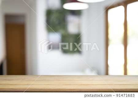 Wooden table with blurred living room background. Copy space for display of product. 91471683