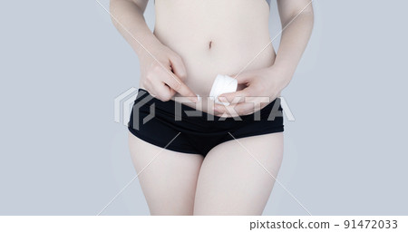 Irritation of the skin of the bikini area. consequences of depilation. Skin injuries. Pimples and redness after shaving. Panty area care concept. Sugaring and waxing. Cream against acne and redness 91472033
