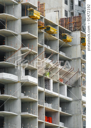 construction of a modern high-rise building, the creation of a concrete frame, building materials and a construction crane construction of a modern high-rise building, the creation of a concrete frame, building materials and a construction crane 91472192