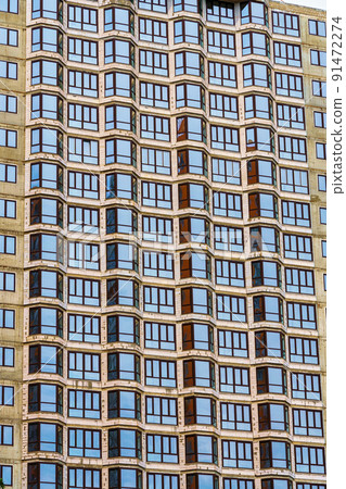 construction of a modern high-rise building, exterior of a apartment house under construction with new windows 91472274