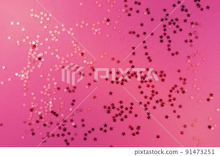 Pink glitter background with shine and red stars, template for event and holiday backdrop, copy space, top view 91473251