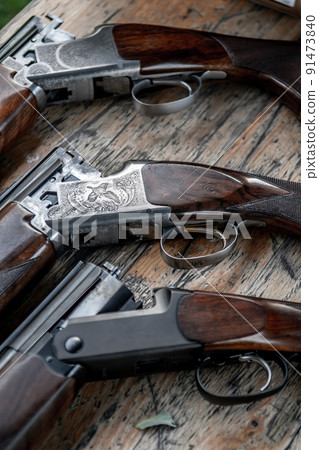 Detail Of Open Hunting Rifles Laying On Table Detail Of Open Hunting Rifles Laying On Table 91473840