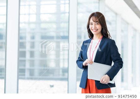 A young female engineer in the office A young female engineer in the office 91475450