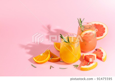 Summer cocktails with grapefruit, orange, rosemary, and ice. 91475595