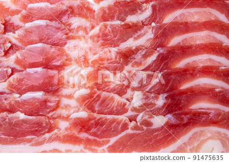 Salt cured pork belly called panceta curada or italian and spanish bacon close up texture meat and fat slices Salt cured pork belly called panceta curada or italian and spanish bacon close up texture meat and fat slices 91475635