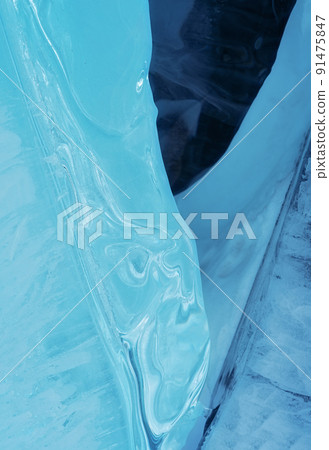 Ice hummocks on Baikal Lake. Transparent blue ice floe at sunset. Natural background. Ice hummocks on Baikal Lake. Transparent blue ice floe at sunset. Natural background. 91475847