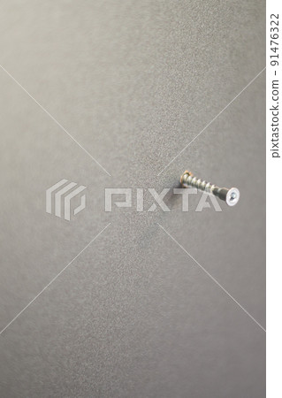 The process of screwing the screw, installation of a sliding door wardrobe. The process of screwing the screw, installation of a sliding door wardrobe. 91476322