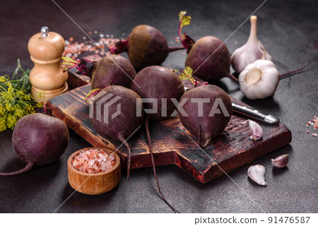 A pile of raw beets on the table. The benefits of vegetables A pile of raw beets on the table. The benefits of vegetables 91476587