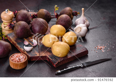 A pile of raw beets on the table. The benefits of vegetables 91476592
