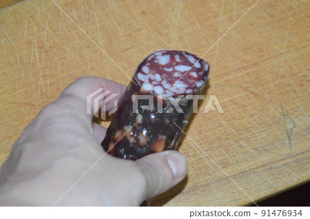 Raw smoked sausage lies on bread like a sandwich Raw smoked sausage lies on bread like a sandwich 91476934