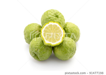 Slice of Thai bergamot isolated on white background. Food and healthcare concept Slice of Thai bergamot isolated on white background. Food and healthcare concept 91477198