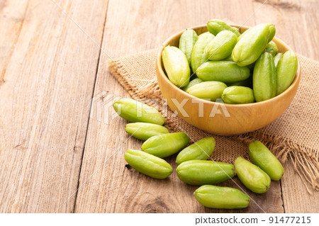 Bilimbi fruit or Averrhoa bilimbi on wooden table background. Food and healthcare concept 91477215