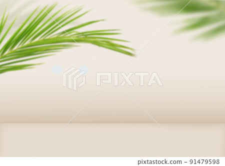Green palm leaves on beige background 91479598