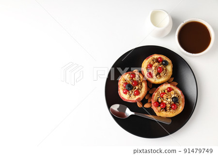 Concept of tasty food with baked apples on white background Concept of tasty food with baked apples on white background 91479749