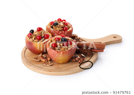 Cutting board with baked apples isolated on white background Cutting board with baked apples isolated on white background 91479761