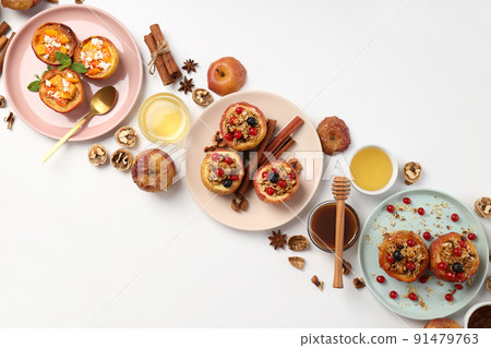 Concept of tasty food with baked apples on white background 91479763