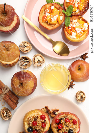 Concept of tasty food with baked apples on white background 91479764
