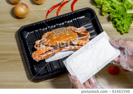 crab on plastic packaging with food absorbent in supermarket, Good quality for food store 91481599